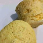 Two small loafs of keto microwave bread made with lupin flour on a white plate.