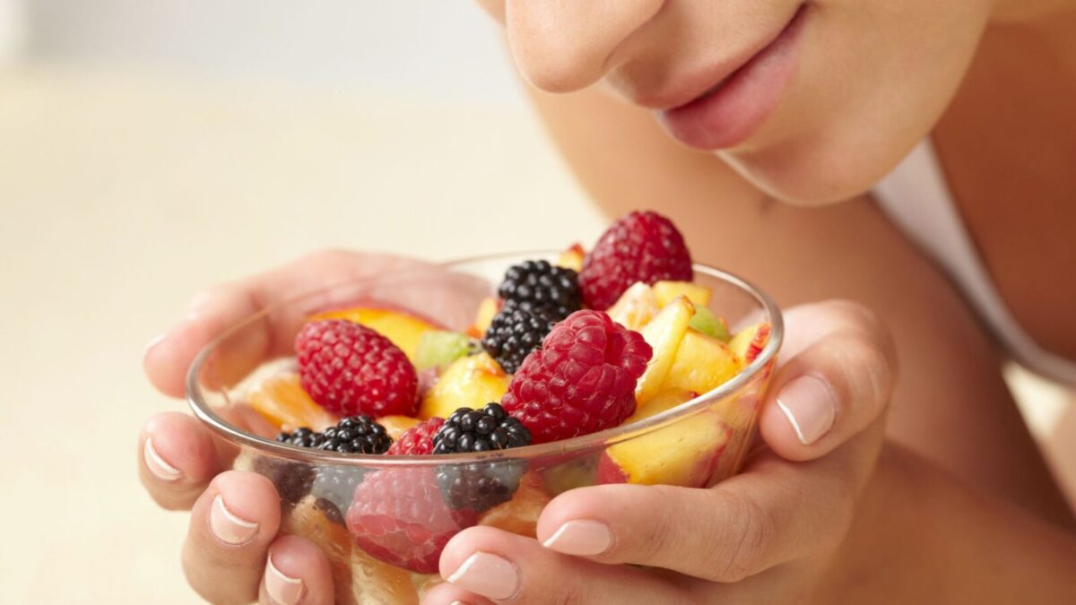 woman with a bowl of fruit