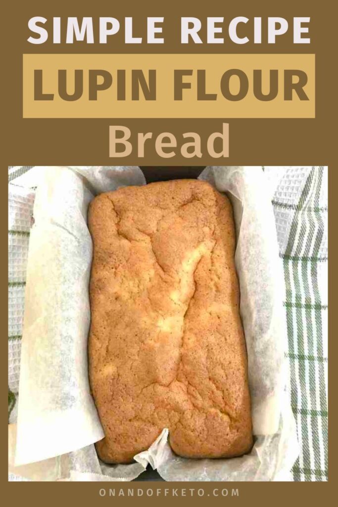 Loaf of lupin flour bread in a parchment-lined pan on a striped cloth, featuring the text "Simple Recipe for Lupin Flour Bread" above.