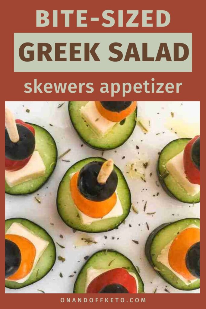 Greek salad skewers featuring cucumber slices topped with feta, cherry tomato, and olive are artfully arranged on a platter.