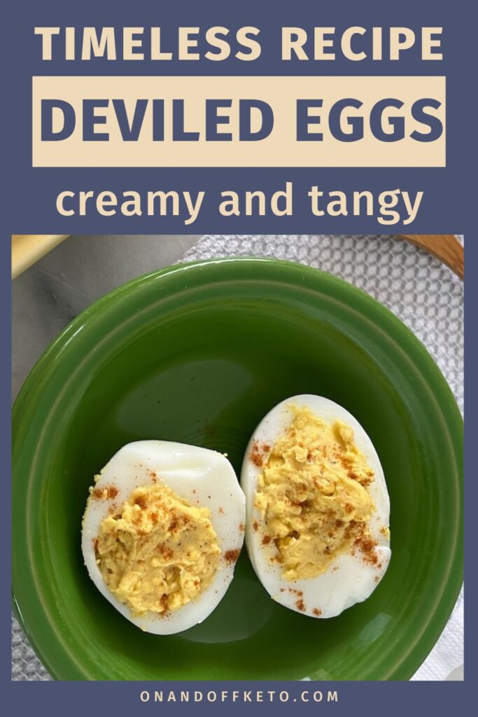 Green plate with two halved classic deviled eggs, sprinkled with seasoning. Text above reads, "Timeless recipe deviled eggs creamy and tangy." URL "onandoffketo.com" below.