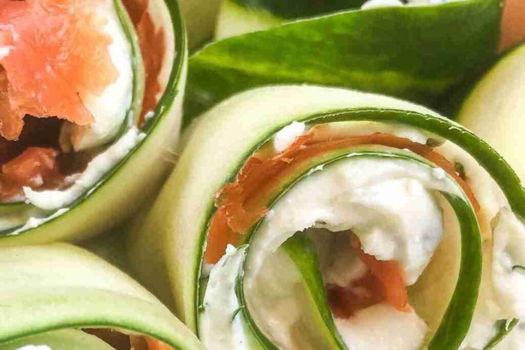 Close-up of cucumber roll-ups filled with cream cheese and smoked salmon.
