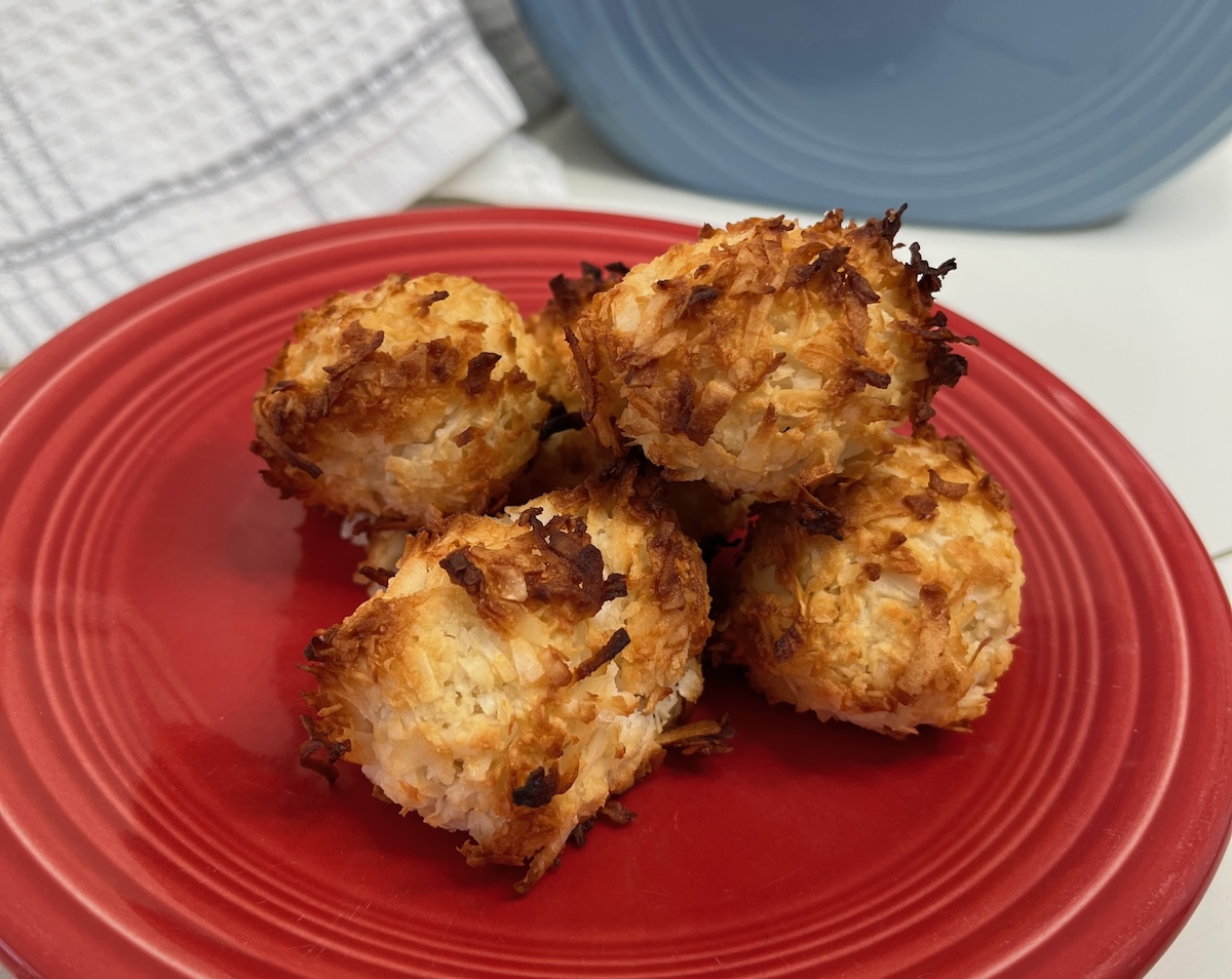 Macaroon cookies on a red plate.