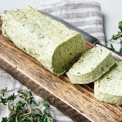 Organic Butter with a herb for sandwiches and steak set, on white stone background.