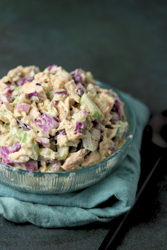 A bowl of salad on a towel.